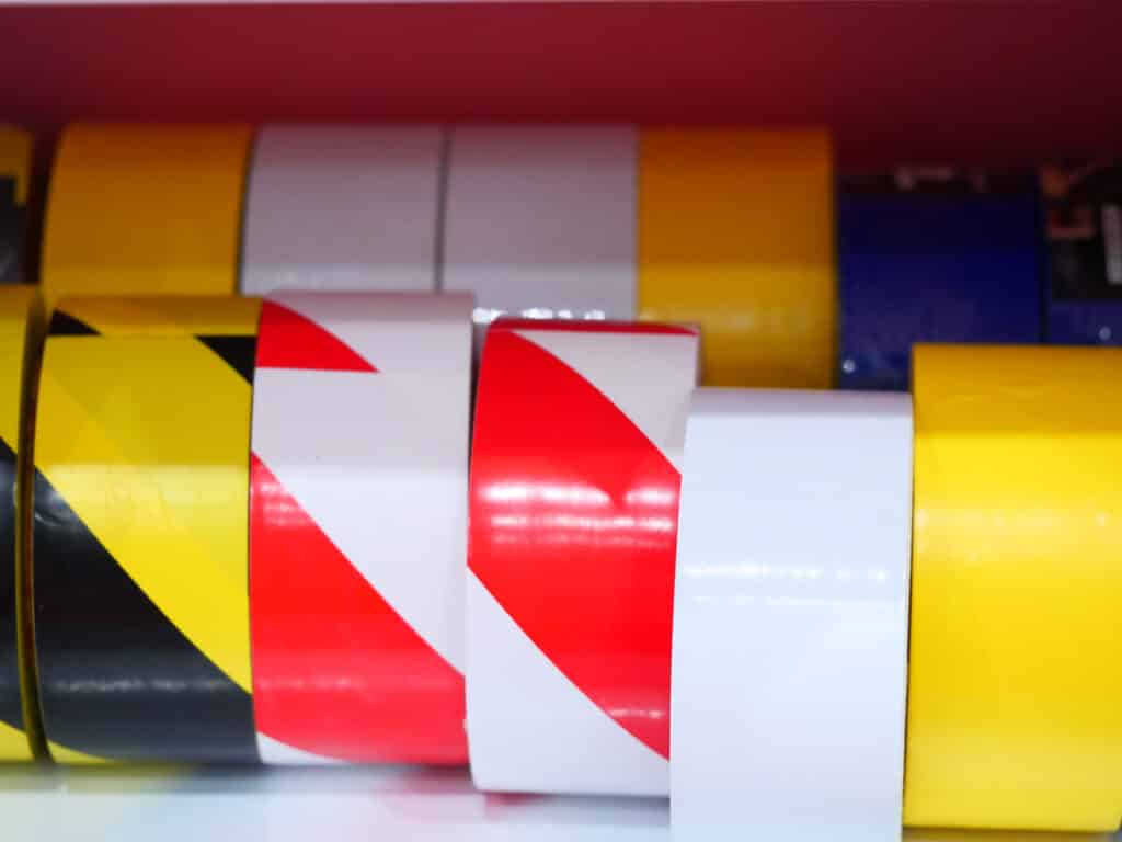 Multi-coloured rolls of tape stored away