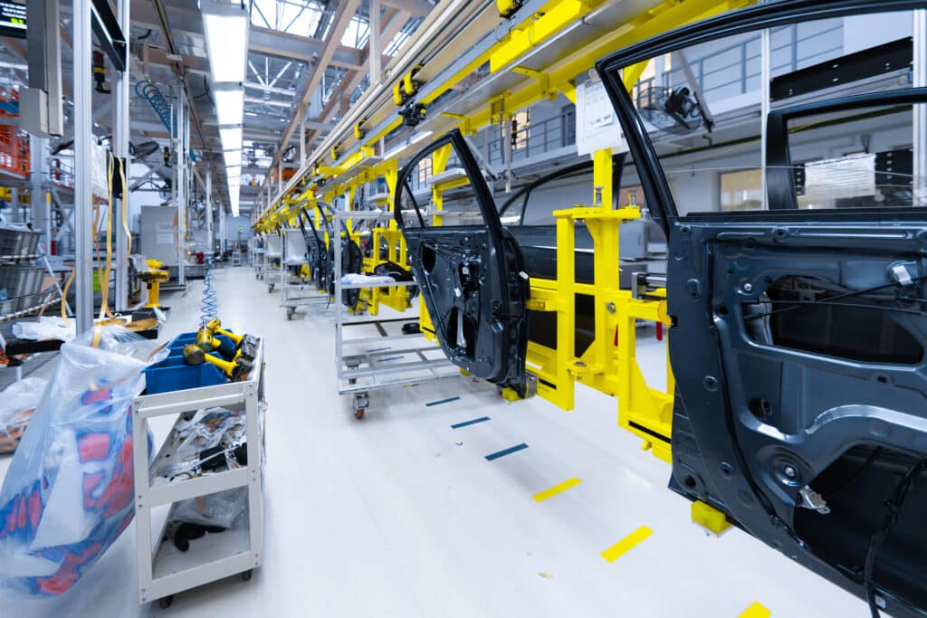 Preparation of doors for installation in car factory. Plant for production and Assembly of new modern cars. Car door on modern production line